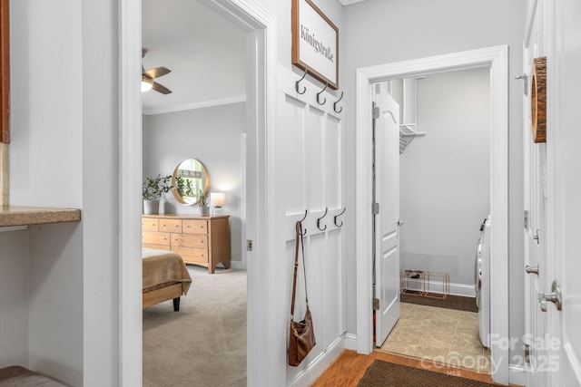 516 King St, Waxhaw, NC 28173 - bathroom with crown molding, washer / dryer, a ceiling fan, and baseboards