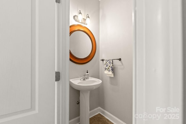 516 King St, Waxhaw, NC 28173 - bathroom featuring baseboards and tile patterned floors