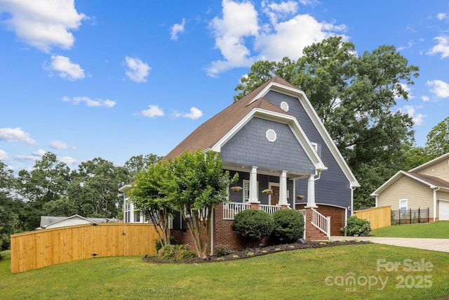 516 King St, Waxhaw, NC 28173 - view of front of home featuring covered porch, a garage, brick siding, and driveway