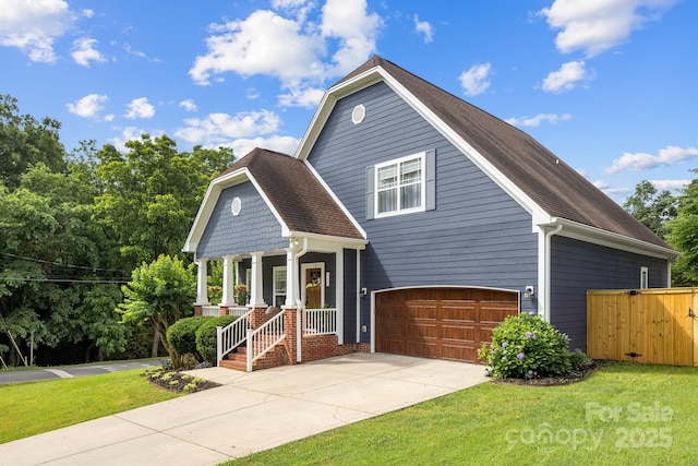 516 King St, Waxhaw, NC 28173 - view of front facade featuring an attached garage, a porch, and concrete driveway