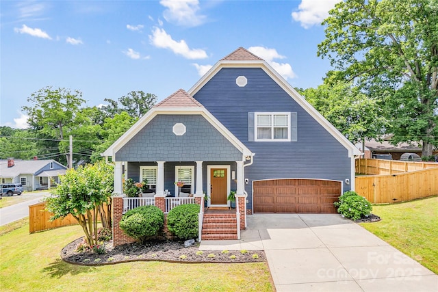 516 King St, Waxhaw, NC 28173 - view of front facade with covered porch, a garage, and concrete driveway