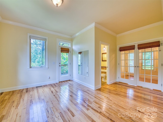20A Lila Ln, Clyde, NC 28721 - spare room with light wood finished floors, ornamental molding, french doors, and baseboards