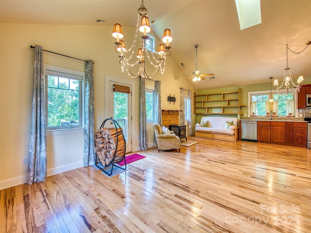 20A Lila Ln, Clyde, NC 28721 - sitting room featuring a chandelier, light wood-style flooring, baseboards, high vaulted ceiling, and ceiling fan