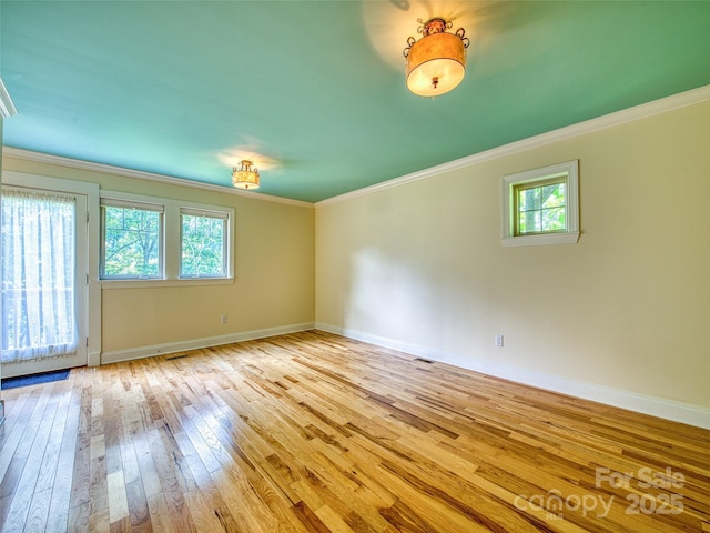 20A Lila Ln, Clyde, NC 28721 - empty room featuring light wood-type flooring, ornamental molding, and baseboards