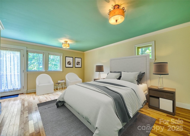 20A Lila Ln, Clyde, NC 28721 - bedroom with hardwood / wood-style flooring, crown molding, and baseboards