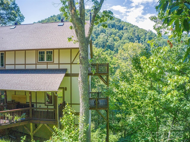 20A Lila Ln, Clyde, NC 28721 - view of property exterior featuring roof with shingles and stucco siding