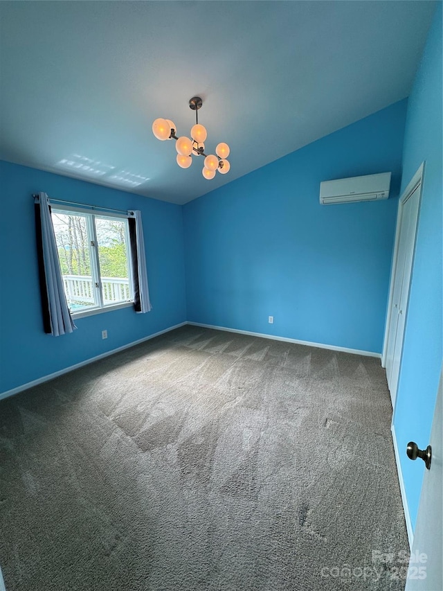 365 Trout Brook Loop, Newland, NC 28657 - empty room with a wall unit AC, carpet flooring, baseboards, and a chandelier