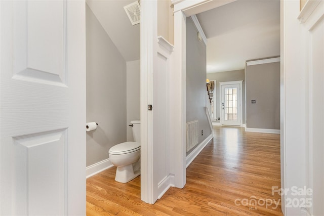 3906 Balsam St, Indian Trail, NC 28079 - bathroom featuring wood finished floors, toilet, lofted ceiling, and baseboards