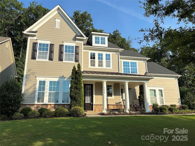 11216 Preservation Ln, Charlotte, NC 28278 - view of front of property featuring covered porch, a front yard, a standing seam roof, stone siding, and a metal roof