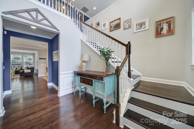 11216 Preservation Ln, Charlotte, NC 28278 - staircase featuring crown molding, wood finished floors, and wainscoting