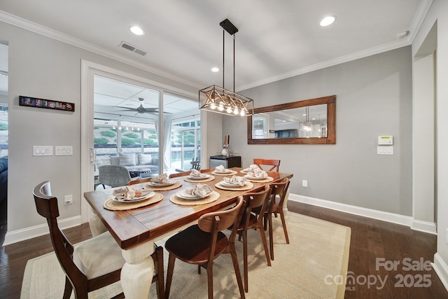11216 Preservation Ln, Charlotte, NC 28278 - dining room featuring crown molding, dark wood-type flooring, and recessed lighting