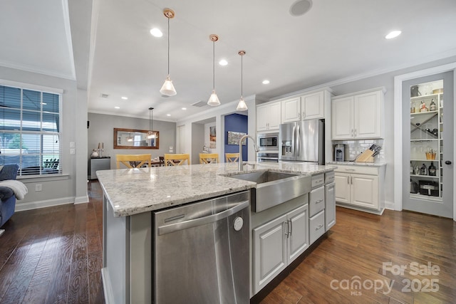 11216 Preservation Ln, Charlotte, NC 28278 - kitchen featuring stainless steel appliances, an island with sink, ornamental molding, white cabinetry, and recessed lighting