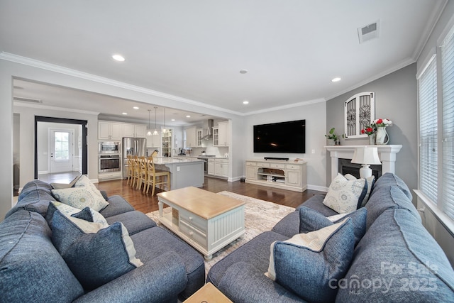 11216 Preservation Ln, Charlotte, NC 28278 - living area featuring dark wood-type flooring, crown molding, and recessed lighting