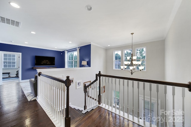 11216 Preservation Ln, Charlotte, NC 28278 - hallway featuring an upstairs landing, a chandelier, recessed lighting, wood finished floors, and ornamental molding