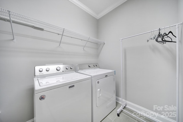 11216 Preservation Ln, Charlotte, NC 28278 - washroom featuring independent washer and dryer, ornamental molding, and light tile patterned floors
