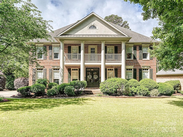 18419 Dembridge Dr, Davidson, NC 28036 - greek revival house featuring brick siding, french doors, and a front lawn