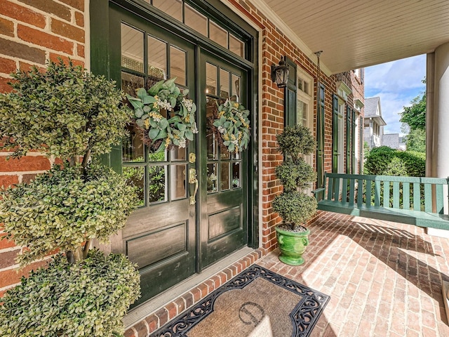 18419 Dembridge Dr, Davidson, NC 28036 - entrance to property with covered porch, brick siding, and french doors