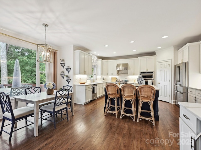 18419 Dembridge Dr, Davidson, NC 28036 - dining room with dark wood-style flooring and recessed lighting