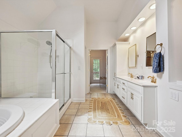 18419 Dembridge Dr, Davidson, NC 28036 - bathroom with a stall shower, recessed lighting, a garden tub, double vanity, and tile patterned flooring