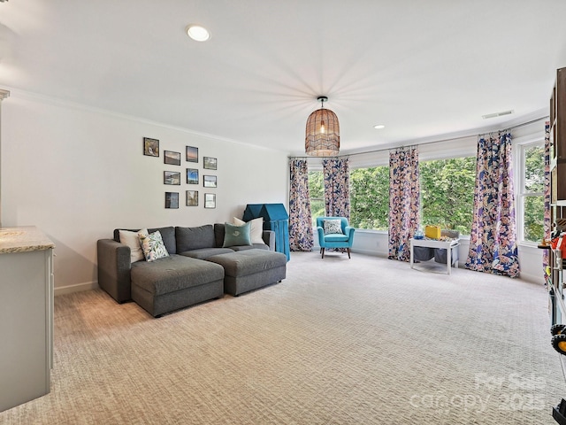 18419 Dembridge Dr, Davidson, NC 28036 - living room featuring light carpet, healthy amount of natural light, ornamental molding, recessed lighting, and baseboards