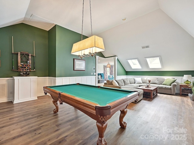 18419 Dembridge Dr, Davidson, NC 28036 - recreation room with lofted ceiling, a wainscoted wall, wood finished floors, a skylight, and pool table