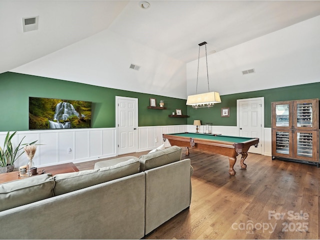 18419 Dembridge Dr, Davidson, NC 28036 - rec room with billiards, wainscoting, high vaulted ceiling, and wood finished floors