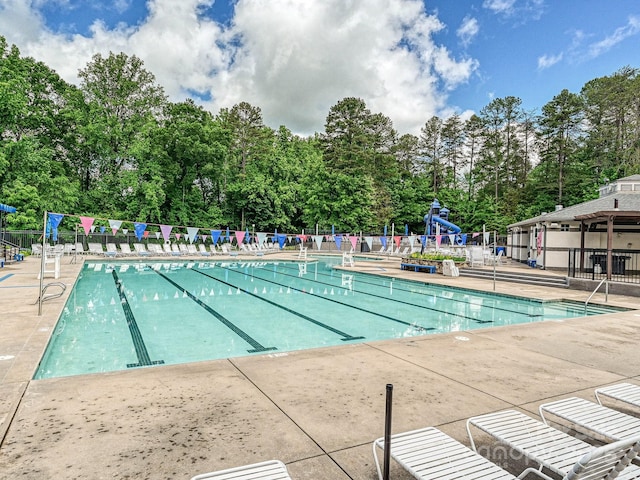 18419 Dembridge Dr, Davidson, NC 28036 - community pool featuring fence and view of wooded area