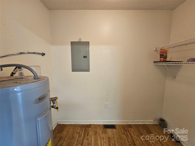 130 Susan Rd Unit 2, Casar, NC 28020 - laundry area with electric panel, electric water heater, wood finished floors, and baseboards