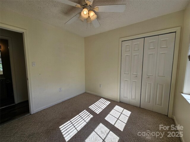 130 Susan Rd Unit 2, Casar, NC 28020 - unfurnished bedroom featuring carpet floors, a textured ceiling, a closet, ceiling fan, and baseboards