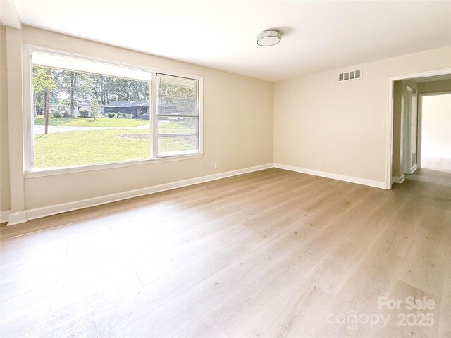 2469 Elkwood Cir, Charlotte, NC 28205 - empty room featuring baseboards and wood finished floors