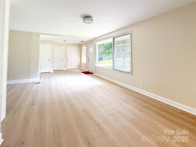 2469 Elkwood Cir, Charlotte, NC 28205 - unfurnished bedroom featuring light wood-style floors and baseboards