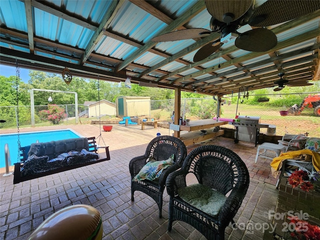 130 Susan Rd, Casar, NC 28020 - view of patio featuring a shed, a fenced backyard, area for grilling, ceiling fan, and an outbuilding