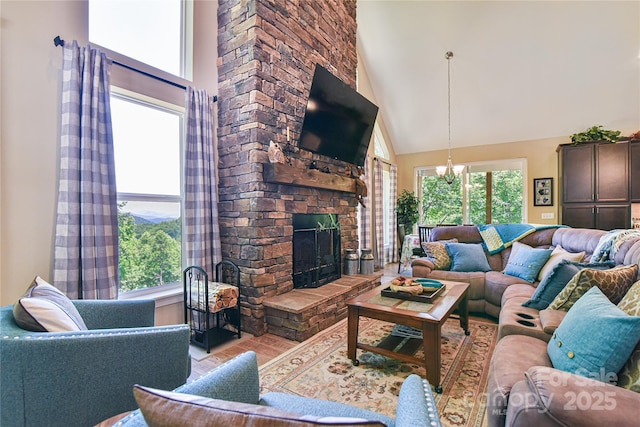140 Atlantic Falls Trl, Black Mountain, NC 28711 - living room featuring high vaulted ceiling, wood finished floors, and a stone fireplace