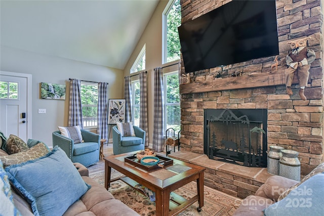 140 Atlantic Falls Trl, Black Mountain, NC 28711 - living area with healthy amount of natural light, a fireplace, wood finished floors, and high vaulted ceiling
