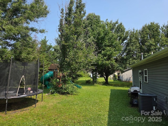 290 Greentree Dr, Rock Hill, SC 29730 - view of grassy yard featuring a trampoline, a playground, and central air condition unit