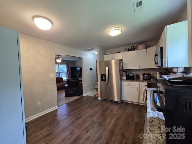 290 Greentree Dr, Rock Hill, SC 29730 - kitchen with appliances with stainless steel finishes, dark wood-style flooring, white cabinetry, a ceiling fan, and baseboards