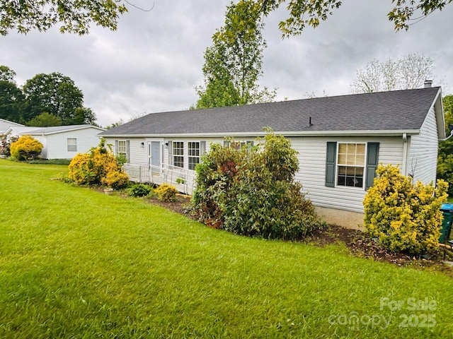 16 English Oaks Dr, Candler, NC 28715 - back of property featuring a yard, a chimney, and a shingled roof