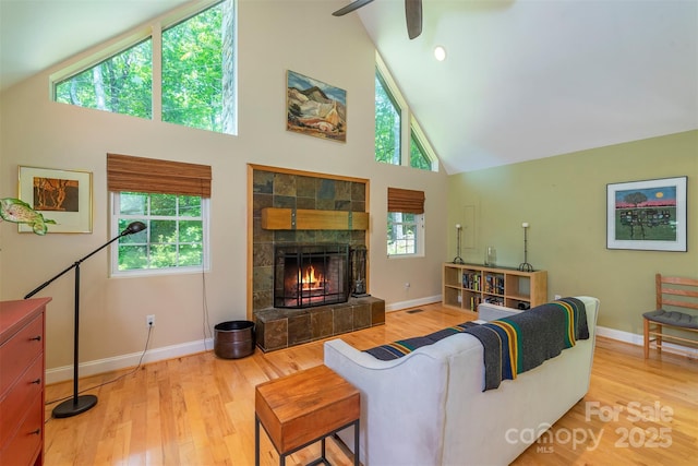 7 Western View St, Black Mountain, NC 28711 - living room with high vaulted ceiling, baseboards, wood finished floors, and ceiling fan