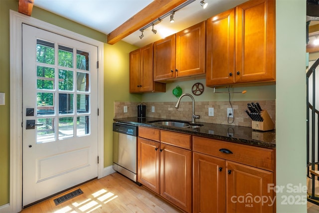 7 Western View St, Black Mountain, NC 28711 - kitchen featuring stainless steel dishwasher, a sink, brown cabinetry, light wood-style floors, and plenty of natural light
