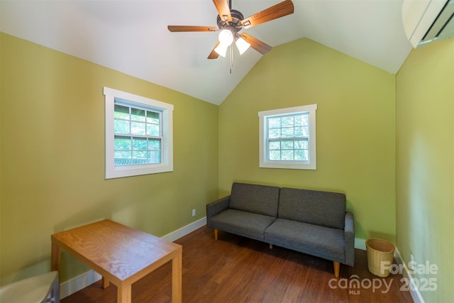 7 Western View St, Black Mountain, NC 28711 - living area featuring a wall unit AC, plenty of natural light, wood finished floors, vaulted ceiling, and baseboards