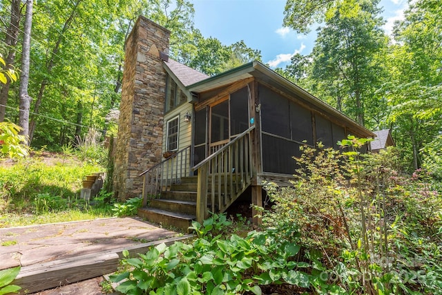 7 Western View St, Black Mountain, NC 28711 - rear view of house featuring a sunroom, a chimney, a patio, and a shingled roof
