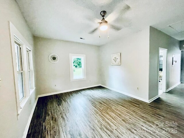 357 Huger St, Cheraw, SC 29520 - unfurnished room featuring dark wood-style flooring, baseboards, and a ceiling fan