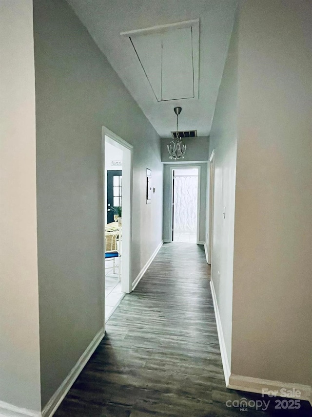 357 Huger St, Cheraw, SC 29520 - hallway with attic access, wood finished floors, and baseboards