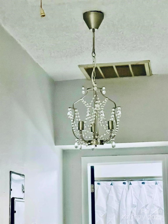357 Huger St, Cheraw, SC 29520 - detailed view of a chandelier and a textured ceiling