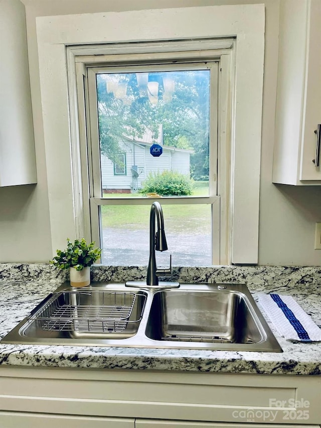 357 Huger St, Cheraw, SC 29520 - kitchen view of a sink and white cabinetry