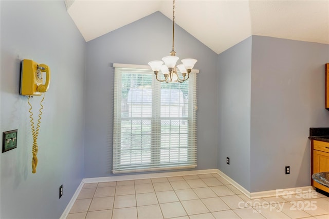 unfurnished dining area featuring a chandelier, vaulted ceiling, light tile patterned flooring, and baseboards