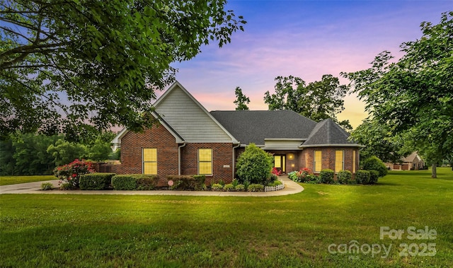 1825 Smyre Farm Rd, Newton, NC 28658 - view of front facade with brick siding and a lawn