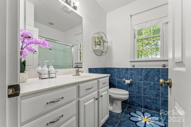 1825 Smyre Farm Rd, Newton, NC 28658 - full bath featuring tile patterned floors, tile walls, toilet, vanity, and a shower with door