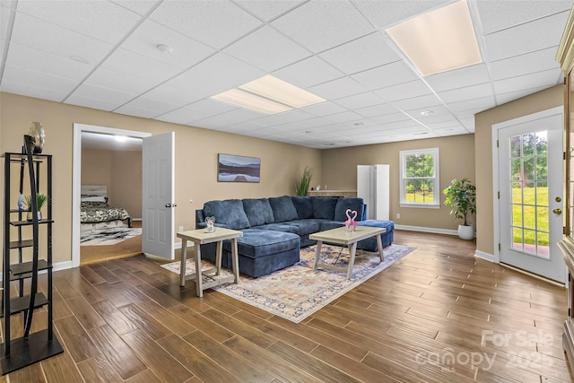 1825 Smyre Farm Rd, Newton, NC 28658 - living room with baseboards, dark wood-style floors, and a drop ceiling