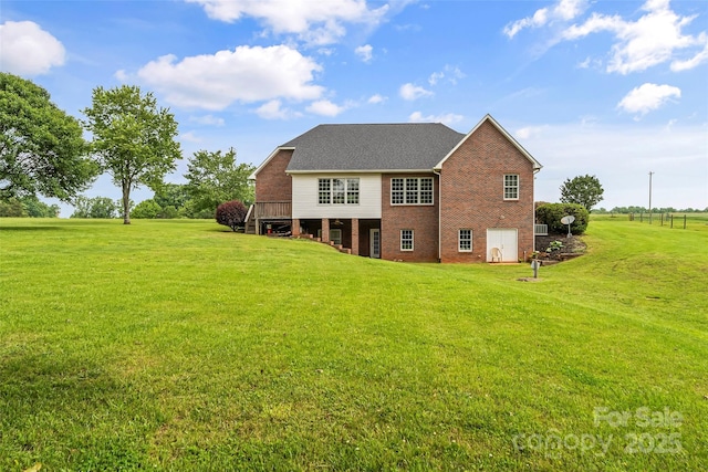 1825 Smyre Farm Rd, Newton, NC 28658 - rear view of house featuring brick siding, a lawn, and a deck